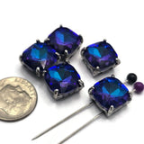 Perfect for jewelry makers who love bold color combinations, these Royal Blue and Amethyst Slider Beads feature large faceted glass stones set in elegant gun metal prong settings. Their striking appearance makes them ideal focal beads for bracelet making, necklace designs, pendants, and artisan jewelry. The two-hole construction allows easy incorporation into multi-strand jewelry, bead weaving, and custom handmade accessories.