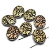 Featuring detailed Tree of Life imagery and warm antique finishes, these focal beads bring texture and character to handmade jewelry. The intricate branches and roots create beautiful visual detail while the dual-hole construction makes them ideal for bracelets, necklaces, pendants, and multi-strand jewelry. These versatile Slider Beads pair beautifully with natural stone beads, wood beads, leather cord, and artisan jewelry components.