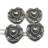 Add a touch of Southwestern-inspired style to your jewelry creations with these decorative Heart Slider Beads. The detailed antique silver finish highlights the raised heart centerpiece while creating beautiful texture and dimension throughout the design. Perfect for bracelet making, necklace designs, pendants, and handmade jewelry, these focal beads pair beautifully with natural stones, pearls, crystals, and leather cord for rustic and artisan-inspired jewelry collections.