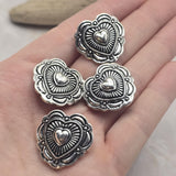 These Heart Concho Style 2 Hole Slider Beads combine meaningful symbolism with elegant metalwork. The antique silver finish enhances every detail, from the raised heart centerpiece to the decorative sunburst accents surrounding it. Perfect for bracelet making, necklace designs, earrings, pendants, and multi-strand jewelry, these focal beads add beauty, character, and versatility to handmade jewelry and artisan accessory collections.