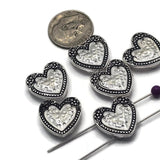 These beautiful Heart Slider Beads combine a classic white faux pearl center with detailed antique silver heart settings for a vintage-inspired look. Ideal for bracelet making, necklaces, pendants, and artisan jewelry, these decorative focal beads complement pearls, crystals, seed beads, and natural stones. Their two-hole design keeps strands aligned, making them perfect for multi-strand jewelry, bead weaving, and elegant handmade jewelry projects.