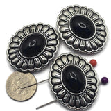 Create bold Southwestern jewelry with these Western Concho Slider Beads featuring polished jet black lucite centers and a platinum silver finish with antique detailing. These 2 Hole Slider Beads pair beautifully with leather cord, turquoise, natural stones, crystals, and seed beads. Ideal for bracelets, necklaces, bead weaving, and custom jewelry, they provide both decorative appeal and secure strand alignment for professional-looking designs.
