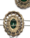 Add vintage elegance to your jewelry designs with these Emerald Green Oval 2 Hole Slider Beads. The ornate antique gold setting and vibrant green cabochon create a timeless focal that complements both traditional and modern jewelry styles. Ideal for bracelet making, multi-strand necklaces, and artisan creations, these decorative slider beads bring sophistication, color, and professional results to every handmade design.