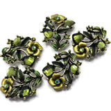 These Floral 2 Hole Slider Beads feature sparkling olivine crystals, detailed enamel flowers and leaves, and an antique silver finish that creates elegant botanical focal beads for handmade jewelry. Perfect for bracelets, necklaces, and multi-strand designs, these decorative metal beads pair beautifully with gemstones, pearls, seed beads, and leather to create nature-inspired jewelry with timeless style and professional results.