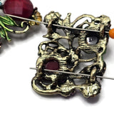 These Floral 2 Hole Slider Beads showcase elegant flowers, scrolling vines, faceted gemstone-style stones, and an antique gold finish for a timeless botanical design. Perfect as focal beads for bracelets, necklaces, earrings, and multi-strand jewelry, these decorative metal beads coordinate beautifully with pearls, gemstones, seed beads, leather, and other jewelry making supplies to create sophisticated handmade jewelry.
