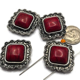 These Western 2 Hole Slider Beads feature faux red turquoise centers surrounded by ornate antique silver metal frames. Perfect as focal beads for bracelets, necklaces, and multi-strand jewelry, their bold square shape brings classic Southwestern style to handmade designs. Pair these decorative metal beads with leather, seed beads, jasper, howlite, or other jewelry making supplies to create rustic Western and cowgirl-inspired jewelry.