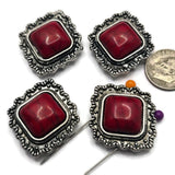 Create bold Western jewelry with these Red Turquoise 2 Hole Slider Beads featuring square faux stone centers and detailed antique silver frames. These decorative metal focal beads are ideal for bracelets, necklaces, bead weaving, and multi-strand jewelry designs. Their Southwestern styling pairs beautifully with leather, natural stone beads, Czech glass, seed beads, and silver findings for distinctive handmade jewelry with rustic character.