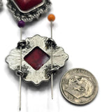 These Red Turquoise 2 Hole Slider Beads combine bold faux stone centers with ornate antique silver frames for a classic Western look. Designed as decorative metal focal beads, they are perfect for bracelets, necklaces, pendants, and multi-strand jewelry. Pair them with leather, turquoise-style beads, jasper, seed beads, or rustic jewelry findings to create eye-catching Southwestern, rodeo, ranch, and cowgirl-inspired handmade designs.