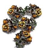 These Floral 2 Hole Slider Beads feature sparkling amber-colored crystals, hand-painted enamel flowers and leaves, and an antique silver finish for a timeless botanical design. These decorative metal focal beads are perfect for bracelets, necklaces, and multi-strand jewelry. Pair them with gemstones, pearls, leather, or seed beads to create elegant handmade jewelry inspired by nature and the warm colors of autumn.