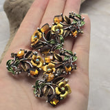 Create beautiful botanical jewelry with these Floral 2 Hole Slider Beads featuring faceted crystals, detailed enamel flowers, and decorative metal leaves. These eye-catching focal beads are ideal for bracelets, necklaces, bead weaving, and artisan jewelry. Their graceful vine design pairs beautifully with Czech glass, natural stone beads, crystals, and leather to create unique handmade jewelry with professional-looking results.