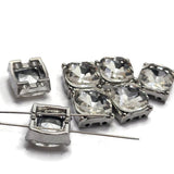 Add brilliant sparkle to handmade jewelry with these Clear Rhinestone 2 Hole Slider Beads featuring faceted glass rhinestones set in platinum silver metal. These elegant focal beads are perfect for bracelets, necklaces, bead weaving, and multi-strand jewelry. Pair these decorative metal beads with pearls, crystals, seed beads, gemstones, or other jewelry making supplies to create bridal, formal, contemporary, or everyday jewelry designs.