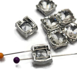 These Platinum Silver 2 Hole Slider Beads feature large faceted clear glass rhinestones for maximum sparkle and timeless style. Perfect as focal beads for bracelets, necklaces, and multi-strand jewelry, these versatile metal beads coordinate with virtually any color palette. Use them with crystals, pearls, Czech glass, seed beads, or gemstones to create elegant handmade jewelry for weddings, special occasions, gifts, or everyday wear.
