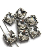 Create sparkling handmade jewelry with these Clear Glass Rhinestone 2 Hole Slider Beads. Each decorative metal bead features a brilliant faceted crystal set into a platinum silver frame, creating an eye-catching focal for bracelets, necklaces, and bead weaving projects. Their dual-hole construction makes these focal beads ideal for multi-strand jewelry while their classic clear design coordinates beautifully with virtually every bead color and jewelry style.