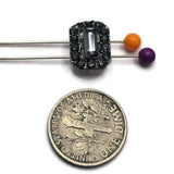 Dark and sparkling, these gunmetal rhinestone slider beads feature jet and hematite crystals in a dimensional rectangular design. The faceted center stone reflects smoky black, charcoal, and metallic silver tones while the surrounding rhinestones add additional brilliance. Two stringing holes make these focal beads perfect for double strand bracelet designs, bead weaving, and multi-strand jewelry. Use them with gemstones, seed beads, or metallic findings for handmade jewelry creations.
