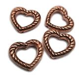 Antique copper heart 2 hole slider beads feature an open center with a detailed twisted rope design and rich antiqued accents. Hidden stringing loops on the back allow you to keep the heart center open or bring strands across the center and decorate them with seed beads. Perfect for double strand bracelets, bead weaving, Western jewelry, boho designs, necklaces, and handmade jewelry.