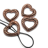 These antique copper rope heart slider beads are versatile jewelry making components for bracelets, necklaces, and bead weaving. Each open heart features hidden 2 hole stringing loops on the back, allowing strands to remain behind the focal or cross through the open center. Add seed beads or tiny crystals across the heart for another design option. Perfect for Western, rustic, boho, romantic, and handmade jewelry designs.