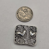 Platinum silver openwork heart slider beads with intricate filigree texture and polished raised heart details. These 2 hole jewelry making beads are ideal for double strand bracelets, bead weaving, seed bead designs, necklaces, romantic jewelry, and DIY jewelry making