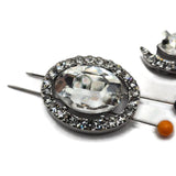 Elegant oval rhinestone focal beads featuring a large clear faceted glass center stone framed with sparkling clear rhinestones in a platinum silver metal tone. These 2 hole slider beads make beautiful jewelry making supplies for double strand bracelets, bridal jewelry, wedding accessories, statement necklaces, bead weaving, and crystal jewelry designs. The classic clear and silver combination coordinates beautifully with pearls, seed beads, gemstones, Czech glass, and other jewelry components.