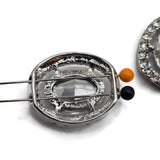 Sparkling clear crystal 2 hole slider beads with a large faceted oval glass rhinestone surrounded by a halo of smaller clear rhinestones. The platinum silver setting creates an elegant, high-end look perfect for bridal jewelry making, wedding jewelry, statement bracelets, necklaces, bead weaving, and multi-strand designs. These glamorous focal beads add incredible sparkle and dimension to DIY jewelry projects, formal accessories, pageant jewelry, and handmade crystal designs.