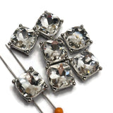 These sparkling 2 Hole Slider Beads combine brilliant clear glass rhinestones with sleek platinum silver metal settings for a classic jewelry making component. Use these rhinestone focal beads in bracelets, necklaces, bead weaving, and multi-strand designs. Their simple, elegant styling pairs beautifully with pearls, gemstones, seed beads, Czech glass, and other jewelry making supplies for bridal, evening, formal, or contemporary handmade jewelry.