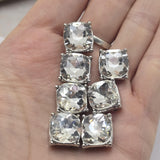 These Clear Crystal 2 Hole Slider Beads add instant sparkle to handmade jewelry without overwhelming the rest of your design. Featuring faceted glass rhinestones in platinum silver metal frames, these decorative focal beads are ideal for bracelets, necklaces, bridal jewelry, and bead weaving. Their two-hole construction works beautifully for multi-strand jewelry and pairs easily with pearls, crystals, gemstones, metal beads, and seed beads.