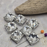 Versatile and sparkling, these Platinum Silver 2 Hole Slider Beads feature large clear glass rhinestones that make beautiful focal beads for handmade jewelry. Incorporate these decorative metal beads into bracelets, necklaces, bead weaving, multi-strand jewelry, bridal accessories, or statement pieces. Their neutral clear and silver combination coordinates with virtually any palette, making them an easy jewelry making supply to use with crystals, pearls, gemstones, or colorful beads.