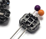 These jet and hematite 2 hole slider beads bring elegant dark sparkle to bracelets, necklaces, and handmade jewelry. Each rectangular bead features a faceted center crystal surrounded by smaller hematite-toned rhinestones in a coordinating gunmetal setting. Their monochromatic black, charcoal, and smoky silver palette works beautifully with modern, gothic, vintage-inspired, and evening jewelry designs. Use these crystal focal beads for bead weaving