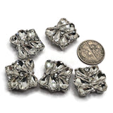 These clear crystal 2 hole slider beads bring beautiful sparkle to bracelets, necklaces, and handmade jewelry. Large faceted teardrop rhinestones create an elaborate flower-inspired design, while smaller clear crystals provide additional shimmer and dimension. The platinum silver or stainless steel-tone metal coordinates easily with pearls, gemstones, seed beads, and crystals.Perfect for double strand bracelets, bead weaving, bridal jewelry, statement designs, and jewelry making.