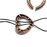 reate unique DIY bracelets with these antique copper open heart 2 hole slider beads. The raised rope pattern and dark antiqued detailing give these heart focal beads beautiful texture and dimension. Hidden loops on the back provide creative stringing options for double strand bracelets, seed bead designs, and bead weaving. Leave the center open or add seed beads across the heart for extra color.