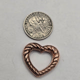 Antique copper 2 hole slider beads with an open heart shape and detailed rope border make beautiful focal beads for DIY jewelry. The hidden stringing loops on the back let jewelry makers create multiple looks with the same bead. String behind the heart for a clean open center or bring strands across the opening and embellish them with seed beads. Perfect for bracelets, bead weaving, Western jewelry, boho jewelry, and necklace designs.