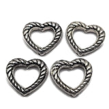 Antique silver open heart 2 hole slider bead with twisted rope detailing and dark antiqued accents. Textured metal focal bead with hidden back stringing loops for double strand bracelets, bead weaving, seed bead designs, necklaces, and DIY jewelry making.