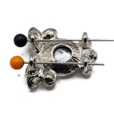 High-quality clear rhinestone 2 hole slider beads in a cool platinum silver metal tone with a brilliant dimensional crystal design. Multiple faceted rhinestone shapes create beautiful sparkle while hidden stringing loops keep the decorative crystal surface visually uninterrupted. Use these statement focal beads for double strand bracelets, necklaces, bead weaving, seed bead jewelry, wedding accessories, formal jewelry, and DIY handmade designs that need an elegant sparkling centerpiece.