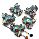 Clear Aurora Borealis rhinestone 2 hole slider beads with a sparkling arrangement of round and marquise faceted crystals in a platinum silver setting. These dimensional focal beads flash beautiful rainbow colors as the light changes, making them ideal for statement bracelets, necklaces, bead weaving, seed bead jewelry, bridal accessories, and DIY jewelry designs. Pair with pearls, gemstones, crystals, or colorful beads for endless handmade jewelry possibilities.