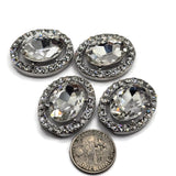 Clear crystal oval slider beads with an oversized faceted glass center rhinestone and sparkling clear rhinestone border in a platinum silver metal tone. These glamorous 2 hole focal beads are ideal for jewelry makers creating bridal jewelry, wedding bracelets, statement necklaces, bead-woven designs, double strand bracelets, and formal accessories. Pair these sparkling jewelry components with pearls, silver findings, or gemstones for elegant handmade jewelry with incredible brilliance.