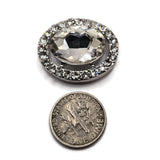 Large oval crystal focal beads covered in brilliant clear sparkle for elegant handmade jewelry designs. These platinum silver 2 hole slider beads feature an oversized faceted clear glass center stone surrounded by smaller high-quality rhinestones. Use these jewelry making components for bridal jewelry, wedding bracelets, statement necklaces, multi-strand designs, bead weaving, pageant jewelry, or formal accessories.