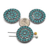 Turquoise enamel western medallion 2 hole slider bead in an antique platinum silver finish. This oversized round focal bead features detailed floral and geometric patterns reminiscent of an ornate western concho. Ideal for statement bracelets, necklaces, western jewelry, bead weaving, and handmade jewelry projects.