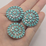 Oversized round western-style focal bead with turquoise enamel and detailed antique platinum silver metalwork. This decorative 2 hole slider bead has an intricate medallion pattern that makes a dramatic centerpiece for western bracelets, statement jewelry, hat bands, bead weaving, and artisan jewelry designs.