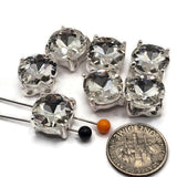These sparkling 2 hole slider beads feature large faceted clear rhinestone centers surrounded by a polished bright silver metal setting. Their clean, elegant design coordinates beautifully with virtually any bead color, making them versatile jewelry-making components for bracelets, necklaces, bridal designs, and bead weaving. Two holes help keep strands separated and properly positioned in double-strand jewelry. Each base measures approximately 13 mm square. You will receive 6 beads per package.
