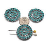 Large antique platinum silver 2 hole slider bead featuring an ornate circular medallion design with contrasting turquoise enamel accents. Repeating teardrop details and textured metalwork give this focal bead a western-inspired concho appearance perfect for bracelets, necklaces, hat bands, and multi-strand jewelry making.
