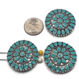 Large round 2 hole slider bead with glossy turquoise enamel detailing and an antique platinum silver finish. The intricate western-inspired medallion pattern features repeating teardrop shapes and dimensional metalwork, creating a bold focal bead for handmade bracelets, necklaces, hat bands, bead weaving, and multi-strand jewelry designs.
