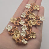 Floral 2 hole slider bead in a bright gold finish with copper, champagne-gold, and creamy white enamel flowers. The sculpted petals and mixed metallic tones create a romantic statement focal for bracelet making, necklaces, bridal jewelry, and handmade jewelry projects.