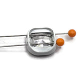 Square white enamel slider beads featuring dark black diamond faceted rhinestone centers for distinctive handmade jewelry designs. These metal 2-hole focal beads have two stringing holes on each side, helping them remain positioned in bracelet and necklace designs instead of constantly flipping. The smoky crystal-style stones add sophisticated sparkle against the white enamel border. Jewelry-making findings for double-strand bracelets, bead weaving, beading projects