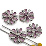 Pink enamel floral 2 hole slider beads in a polished bright silver finish for handmade jewelry making. Each 17 mm flower features alternating soft pink enamel and shiny silver petals surrounding a dimensional center. Two stringing holes help keep these decorative focal beads positioned in double-strand bracelets and multi-strand designs. Flower jewelry components for bead weaving, beaded bracelets, necklaces, spring jewelry, DIY jewelry making, and feminine handmade jewelry projects.