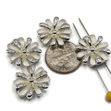 White enamel floral 2 hole slider beads in a polished bright silver finish for handmade jewelry making. Each 17 mm flower features alternating creamy white enamel and reflective silver petals with a dimensional center. Two side holes spaced approximately 5 mm apart make these flower focal beads ideal for double-strand bracelets, bead weaving, necklaces, cuffs, and multi-strand jewelry designs.