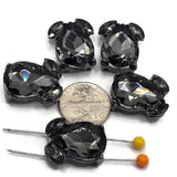 Gunmetal 2 hole slider beads featuring large faceted Black Diamond teardrop rhinestones with two smaller coordinating crystal accents. Each 20 mm focal bead has two hidden stringing loops on the back, approximately 9 mm apart, for double-strand jewelry designs. Smoky gray rhinestones and dark gunmetal metal create dramatic sparkle for handmade bracelets, necklaces, bead weaving, statement jewelry, and creative jewelry-making projects.