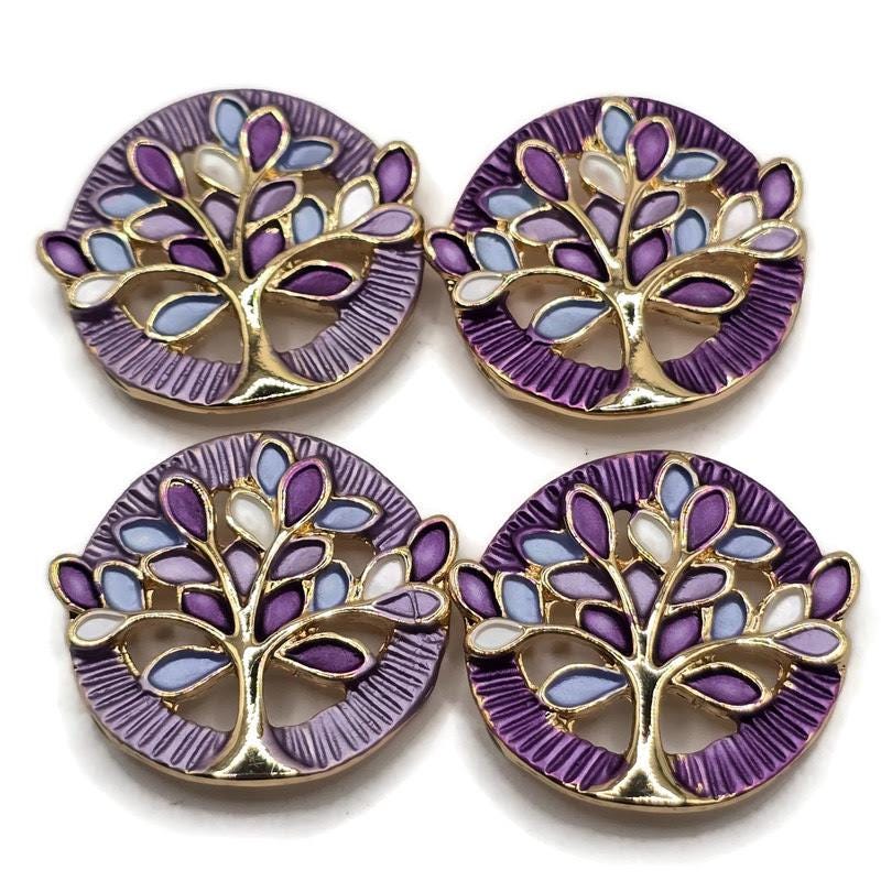 Colorful Tree of Life jewelry making beads with beautiful bright gold branches and delicate enamel leaves in shades of purple, lavender, blue, and white. These decorative 2 Hole Slider Beads feature an elegant round shape with detailed openwork metal designs. Ideal for bracelet making, necklace designs, multi-strand jewelry, and handmade accessories. Unique jewelry findings and focal beads for creating inspirational jewelry, thoughtful gifts, and beautiful nature-inspired jewelry collections.