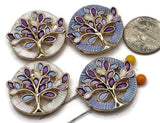 Beautiful Tree of Life 2 Hole Slider Beads featuring colorful purple, lavender, light blue, and white enamel leaves with bright reflective gold branches. These round jewelry focal beads feature complementary pearly white and soft blue circular backgrounds with decorative textured detailing. Perfect for handmade bracelet designs, necklace making, bead weaving, and multi-strand jewelry projects. Unique jewelry making supplies for beginners and experienced jewelry designers creating colorful