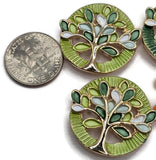 Unique Tree of Life jewelry making beads featuring a vibrant combination of deep green, bright lime, soft mint, and white enamel details accented by reflective gold metalwork. These beautiful round 2 Hole Slider Beads combine delicate openwork tree designs with contrasting dark green and lime textured borders. Ideal for handmade bracelets, necklaces, earrings, and inspirational jewelry creations. Beautiful focal beads for botanical jewelry, spring accessories, and personalized handmade designs.