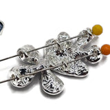 Decorative Blue Flower Slider Beads featuring three beautifully detailed enamel blossoms with soft aqua and deeper blue petals. The overlapping floral arrangement creates a dimensional jewelry focal bead accented with polished silver outlines and textured silver flower centers. Excellent jewelry making components for bracelet designs, necklace making, spring accessories, and handmade gifts. Unique beading supplies for jewelry designers