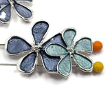 Elegant dark blue enamel flower jewelry making beads featuring a beautiful arrangement of three overlapping five-petal blossoms. Rich slate blue and smoky denim blue flowers create a sophisticated appearance, while a soft aqua accent flower adds contrasting color. These bright silver 2 Hole Slider Beads feature polished petal outlines and decorative silver centers. Ideal jewelry findings for bracelet making, necklace designs, handmade gifts, and unique floral jewelry collections.
